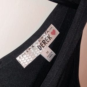 A black romper with pockets